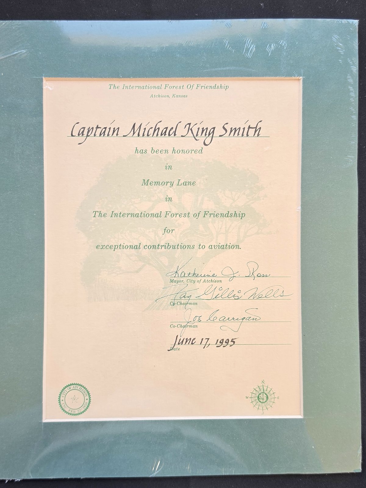 Certificate from The International Forest of Friendship, Atchison, Kansas, stating that Captain Michael King Smith has been honored in Memory Lane for exceptional contributions to aviation, June 17, 1995